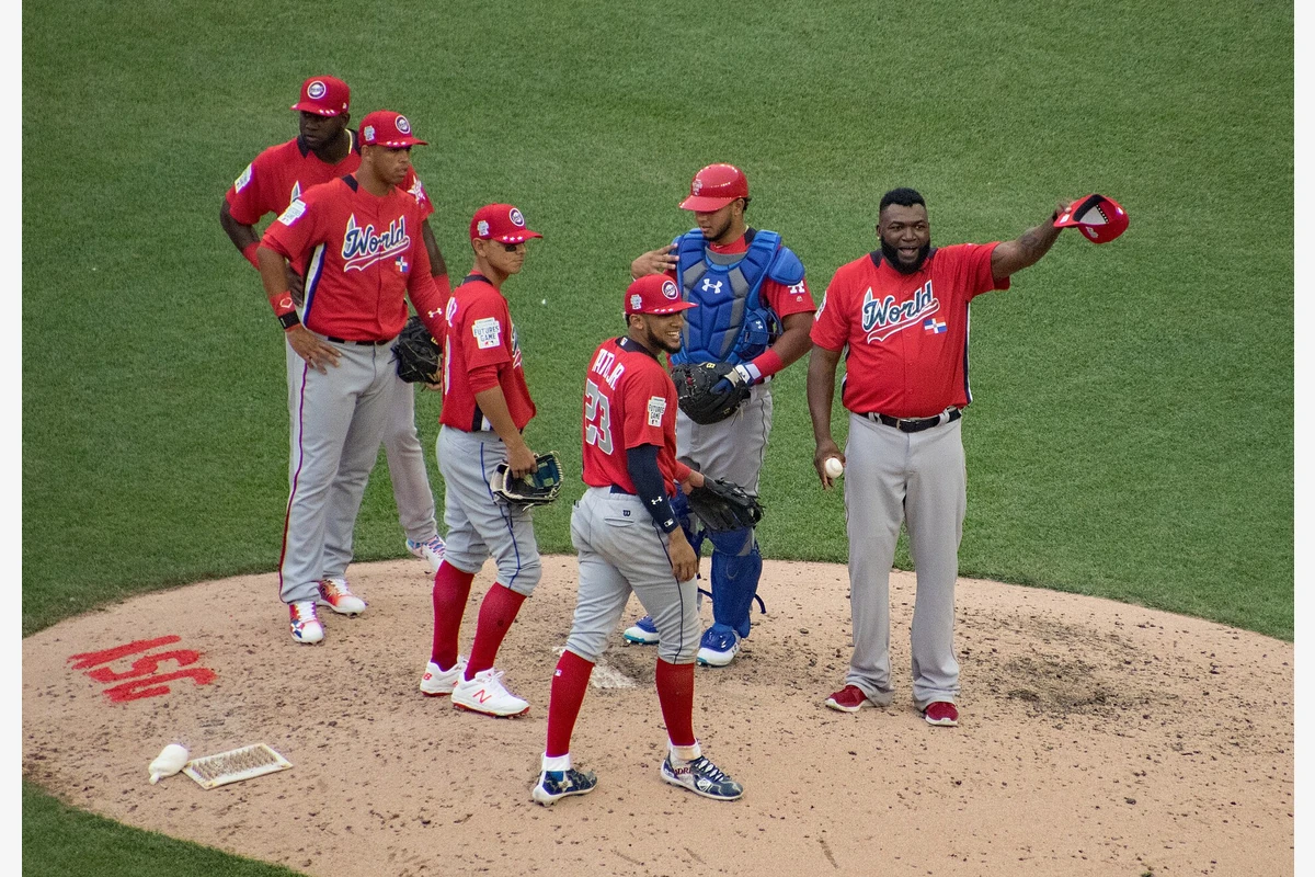 World Team manager David Ortiz gestures during a mound visit at the 2018 All-Star Futures Game at Nationals Park in Washington, D.C., joined by teammates including catcher Keibert Ruiz and infielder Yordan Alvarez.